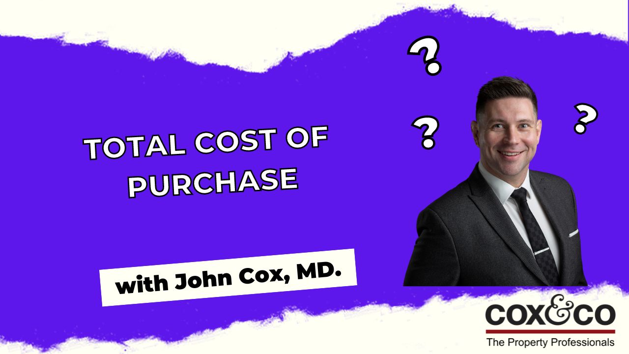 Cox & Co Estate agent in Edinburgh, Scotland. An image featuring the text "Total Cost of Purchase" prominently in blue on a white background. To the right is a man in a dark suit smiling, with three question marks around him. Below the main text is "with John Cox, MD." The "Cox&Co The Property Professionals" logo is at the bottom, specializing in Property Sourcing.